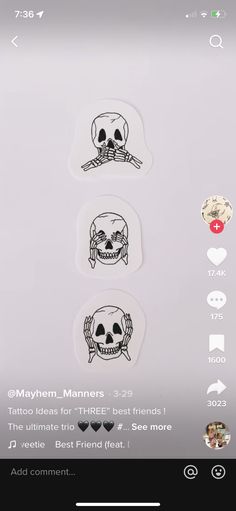 some stickers that are on the back of a cell phone, with skulls and bones