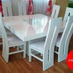 a white table and chairs in a room