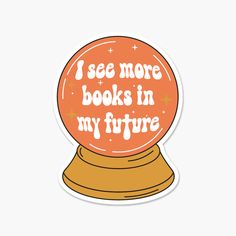 an orange snow globe with the words i see more books in my future on it