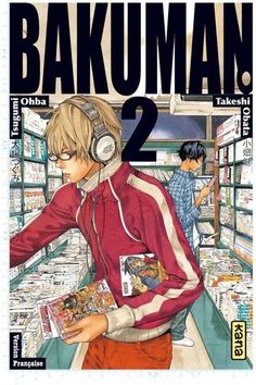 the cover to bakuman 2, with headphones on and in front of him