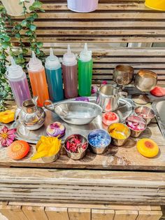 a wooden table topped with lots of different types of condiments