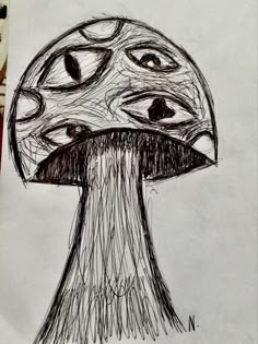 a drawing of a mushroom with eyes drawn on it