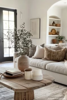 a living room filled with lots of furniture and decor on top of a rug next to a coffee table