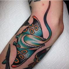 a man's foot with a tattoo on it and an image of a butterfly