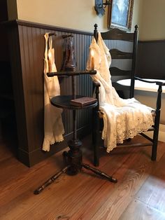 a chair and table in a room with wooden floors