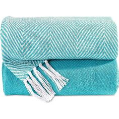 two blue towels with white fringes on them