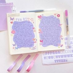 an open notebook with writing on it next to washi tape, scissors and other items