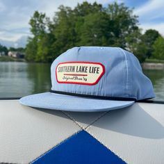 Expertly crafted: SLL PATCH SKY BLUE ROPE HAT is a durable and comfortable cotton/poly blend with a plastic snapback for an adjustable fit. With UPF 50+ and water repellent properties, this hat protects from the sun and water while showcasing the OG SLL PATCH design.   * Cotton/Poly Blend *  Plastic Snapback * UPF 50+ * Water Repellent Summer Camping Hats With Flat Bill, Summer Camping Hat With Flat Bill, Blue Cotton Sun Hat For Outdoor Use, Blue Cotton Sun Hat For Outdoor, Blue Cotton 5-panel Snapback Hat, Adjustable Light Blue Outdoor Hats, Blue Snapback Hat For Summer Outdoor Activities, Blue Cotton Baseball Cap For Outdoor, Blue Cotton Snapback Trucker Hat