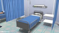 a hospital room with a bed, chair and other medical equipment on the floor in front of blue drapes