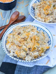 two bowls filled with rice on top of a table