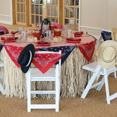 the table is decorated with red, white and blue decorations