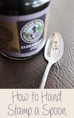 a spoon sitting on top of a table next to a jar of christmas gift items