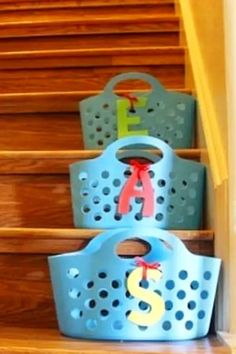 three baskets are sitting on the stairs