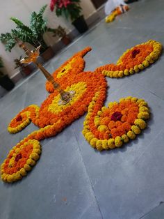 an elaborately designed flower arrangement on the floor