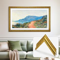 a painting hanging on the wall above a couch