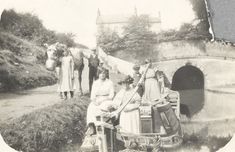 an old black and white photo of people on a boat