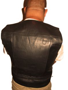 We offer a NWT Black Cowhide Leather vests in assorted sizes with side Laces. (Clearance Priced) 100% Genuine First Quality Cowhide Leather Lace up sides for a perfect fit Fully lined in Black polyester Two large front pockets and two wallet size pockets inside Soft flexible feel for a comfortable fit Grainy leather texture Four metal snap front closures Heavy weight material weighing 1 1/2 to 3 pounds each depending on the size See below for exact measurements Made in PakistanLeather clothing r Black Fitted Biker Vest, Fitted Biker Vest For Biker Events, Black Sleeveless Vest For Motorcycling, Black Sleeveless Motorcycling Vest, Black Sleeveless Motorcycle Vest, Black Fitted Motorcycle Vest, Classic Fitted Vest For Biker Events, Leather Vests, Motorcycle Vest