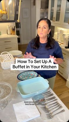 a woman standing in front of a kitchen counter with silverware on it and the words how to set up a buffet in your kitchen