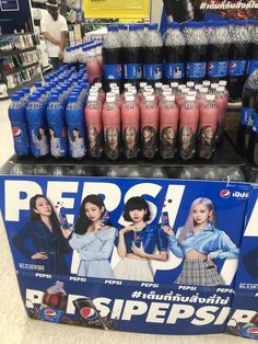 pepsi sodas are stacked on display in a store