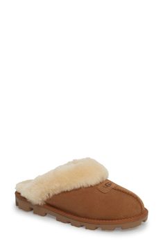 Genuine shearling lining creates superior softness and warmth in this comfy, cozy slipper. Wear it barefoot for maximum benefit; genuine sheepskin helps keep feet dry and comfortable in cold temperatures. The sturdy sole on ensures durability and makes the style ideal for indoor and outdoor wear. Style Name:UGG Genuine Shearling Slipper (Women). Style Number: 127311. Classic Indoor Slippers, Classic Sheepskin Slip-on Slippers, Classic Sheepskin Slippers For Winter, Classic Shearling Slippers For Winter, Classic Brown Sheepskin Slippers, Casual Brown Shearling Slippers, Classic Shearling Slip-on Slippers, Casual Brown Sheepskin Slippers, Comfortable Brown Shearling Slippers