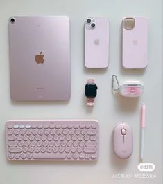 an apple keyboard, mouse, and other electronics are arranged on a table