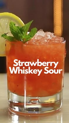 a strawberry whiskey sour sitting on top of a counter