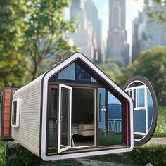 a tiny house with two windows on the outside and one in the inside is shaped like a boat