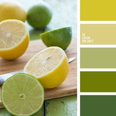 two lemons and one lime are on a cutting board with green paint swatches