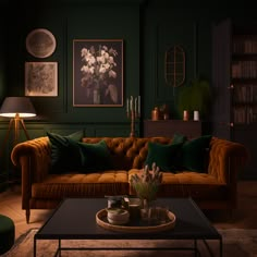 a living room with green walls and furniture in the corner, including a couch that has pillows on it