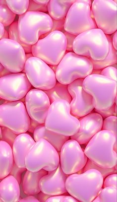 many pink hearts are scattered together in this image, as if they were floating or floating on the ground