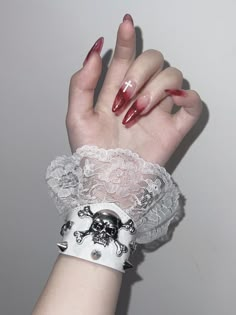 This bracelet features skeleton and stud decorations with lace trim design, available in pure white, pure black, and black and white.   The price is for a bracelet only, others are not included. White Punk Jewelry For Festival, White Punk Festival Jewelry, White Gothic Skull Jewelry, Gothic White Jewelry For Festivals, White Gothic Jewelry For Festivals, Gothic White Festival Jewelry, White Gothic Festival Jewelry, Vkei Nails, Goth Nail Ideas