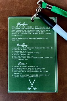 a green menu with golf related items and a white pen on it next to a pair of scissors