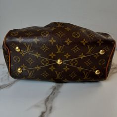 Authentic Louis Vuitton Tivoli Pm Condition Quality; Good Color; Brown Height;8.5 In. Length; 11 In Width; 5;5 In. Country; France Material/Desing; Brown Coated Canvas/Leather, Brass Hardware, Rolled Handles. Canvas Lining On Inside And Dual Interior Pockets With Zipper Closs At The Top. Item Condition: Pre-Owned, Smoke-Free, Zero Odor (Minor Wear Can Bee See In Photos) Note: Sale Does Not Include Original Box Or Dust Bag. Date Code; Vi21u91 Louis Vuitton Tivoli, Country France, Louis Vuitton Flower Mm Monogram Canvas & Cowhide Leather Zipped Tote Noir, Brown Coat, Authentic Louis Vuitton, Canvas Leather, Brass Hardware, Monogram Canvas, Womens Tote Bags