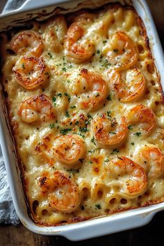 a casserole dish with shrimp and cheese