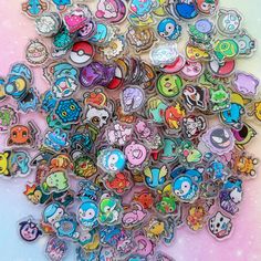 a pile of cartoon pins sitting on top of a table