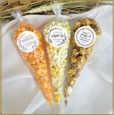 three different types of popcorn in plastic bags