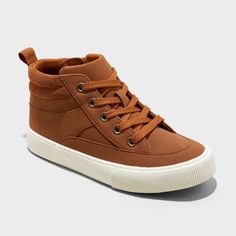 Spruce up your child's shoe wardrobe with these Cooper Mid-Top Sneakers Boots from Cat & Jack™. These cognac boots boast a faux-leather upper, round toe, and soft fabric insole and lining. Enhanced with a padded collar, lace-up front and side zipper, the mid-top shoes keep your child comfortable wherever they go. Cat & Jack™: Designed for all children so you can trust it's made for yours. Mid Top Shoes, Cognac Boots, Shoe Wardrobe, Mid Top Sneakers, Rubber Boot, Footbed Sandals, Children Shoes, Retro Sneakers, Mid Top