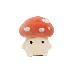 a small mushroom with white dots on it's head is sitting in front of a white background