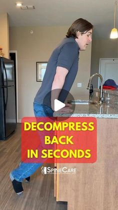 a man standing on top of a counter in a kitchen