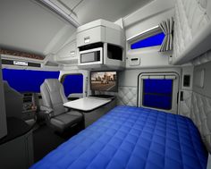 the interior of an airplane with blue bedspreads