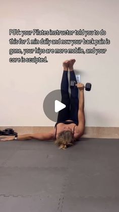 a woman is doing an exercise on the floor