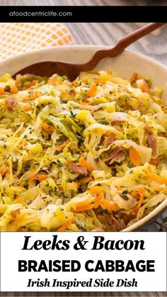 leeks and bacon braised cabbage in a white bowl with a wooden spoon on the side