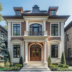 a large house with lots of windows and doors