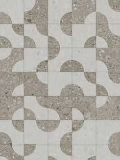 an abstract tile design in grey and white