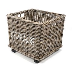 a wicker basket on wheels with the word'dwp'painted on it