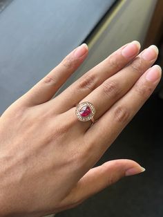 Prepare to be captivated by the sheer elegance of this exquisite Statement Ring, guaranteed to steal your heart at first glance! At the heart of this ring lies a magnificent 1.88 Carat Red Ruby centerpiece. This ruby is a true natural gem, It has been expertly cut into a flawless Cabochon shape, showcasing its vibrant red hue in all its glory. Ruby Originates from Mozambique, and has been heated.  This symmetrical design is adorned with 0.45 Carat Rose Cut Diamonds, enhancing the ring's allure. Formal Rose Gold Ruby Ring With Round Cut, Symmetrical Design, Red Ruby, Ruby Ring, Rose Cut Diamond, Gold Set, Mozambique, The Rose, Rings Statement