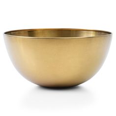 a gold colored bowl on a white background