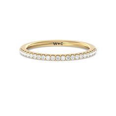 a yellow gold wedding band with white diamonds