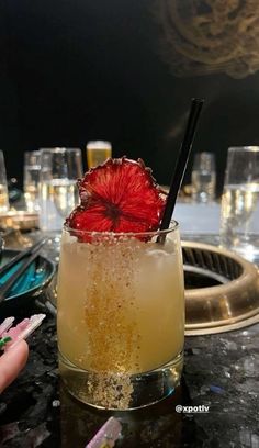 a drink with strawberries in it sitting on a table