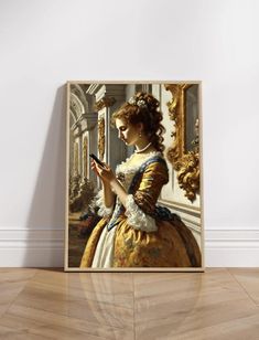 a woman looking at her cell phone while standing in front of a painting on the wall